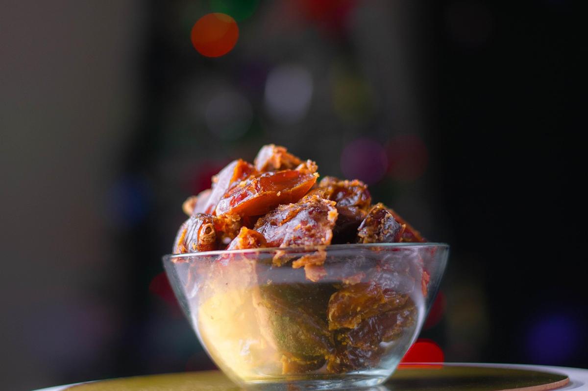 A traditional bowl of dates and a glass of water prepared for breaking a fast at sunset