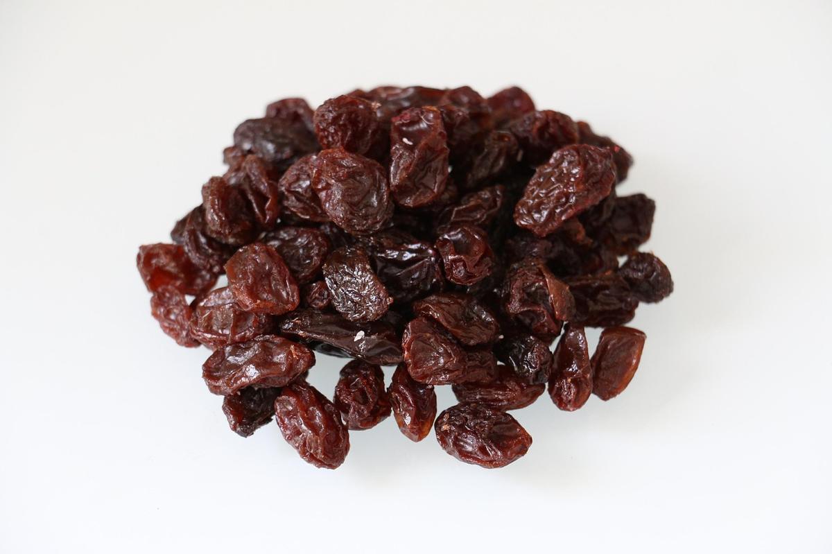 Small bowls of raisins, dried apricots and dried figs