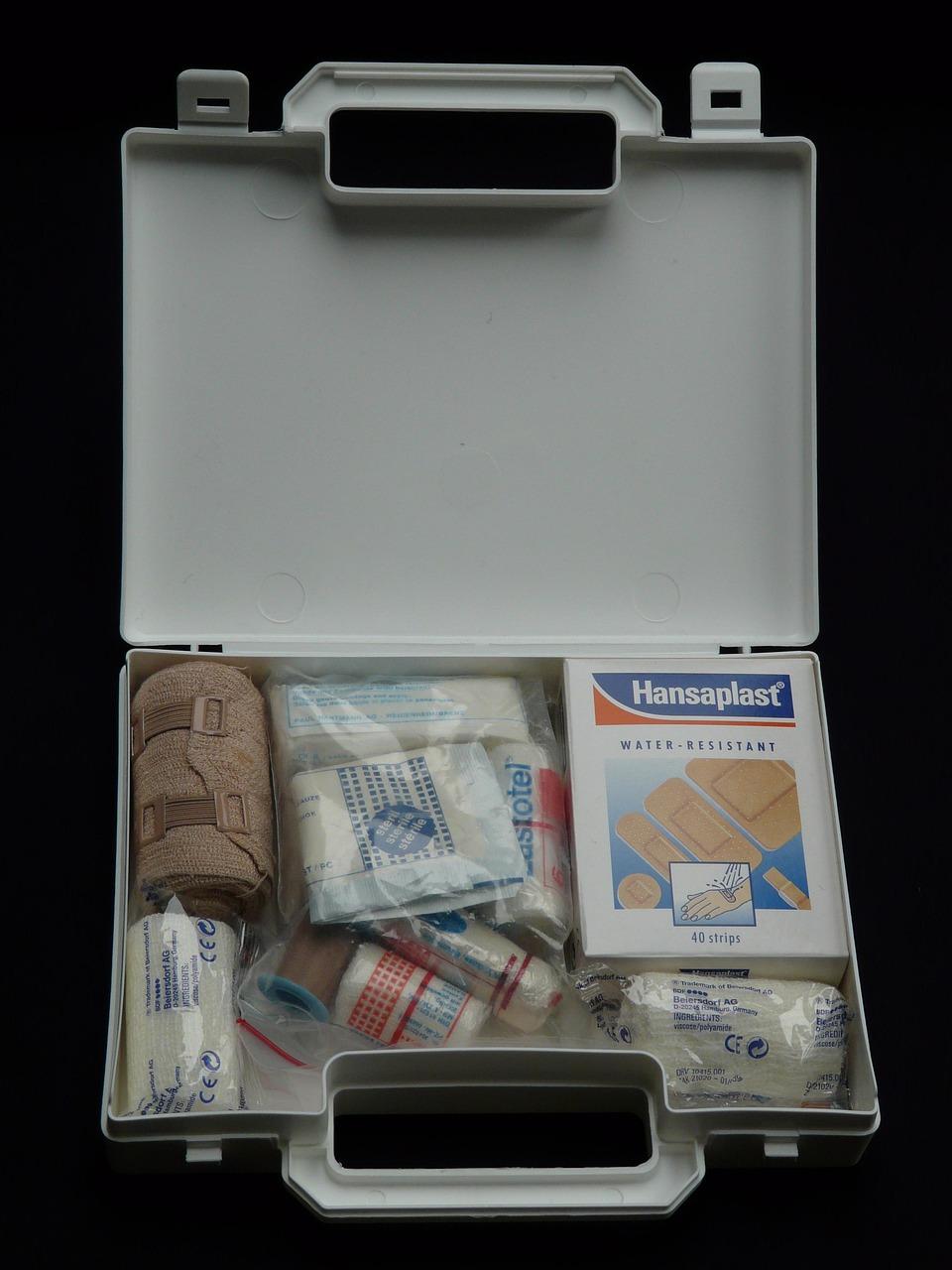 Organized pouch containing glucose tablets, test strip vial, spare batteries, and emergency contact card