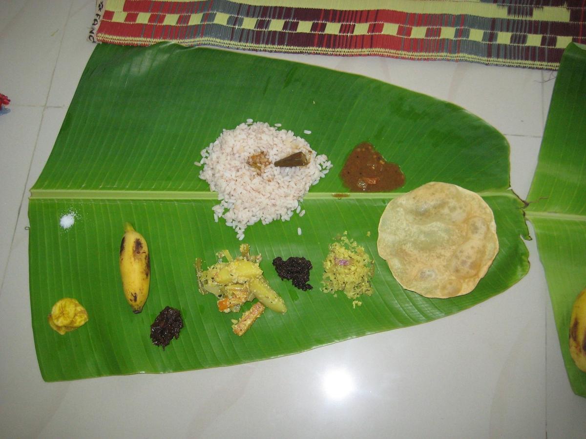 Chakki roti, basmati rice bowl, and a cooked paratha presented side by side